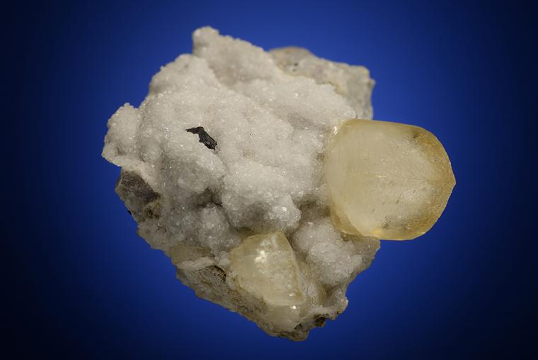CALCITE with COPPER on ANALCIME